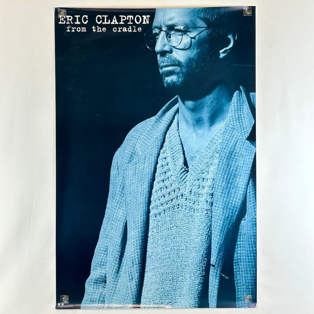 Promo poster for 'From the Cradle' by Eric Clapton with a blue-toned portrait of the artist.