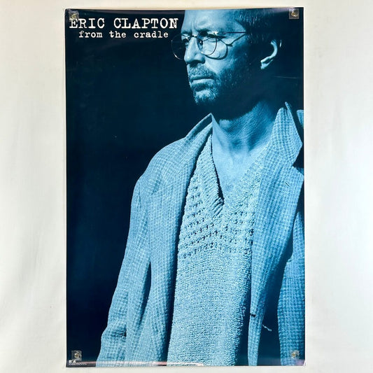 Promo poster for 'From the Cradle' by Eric Clapton with a blue-toned portrait of the artist.