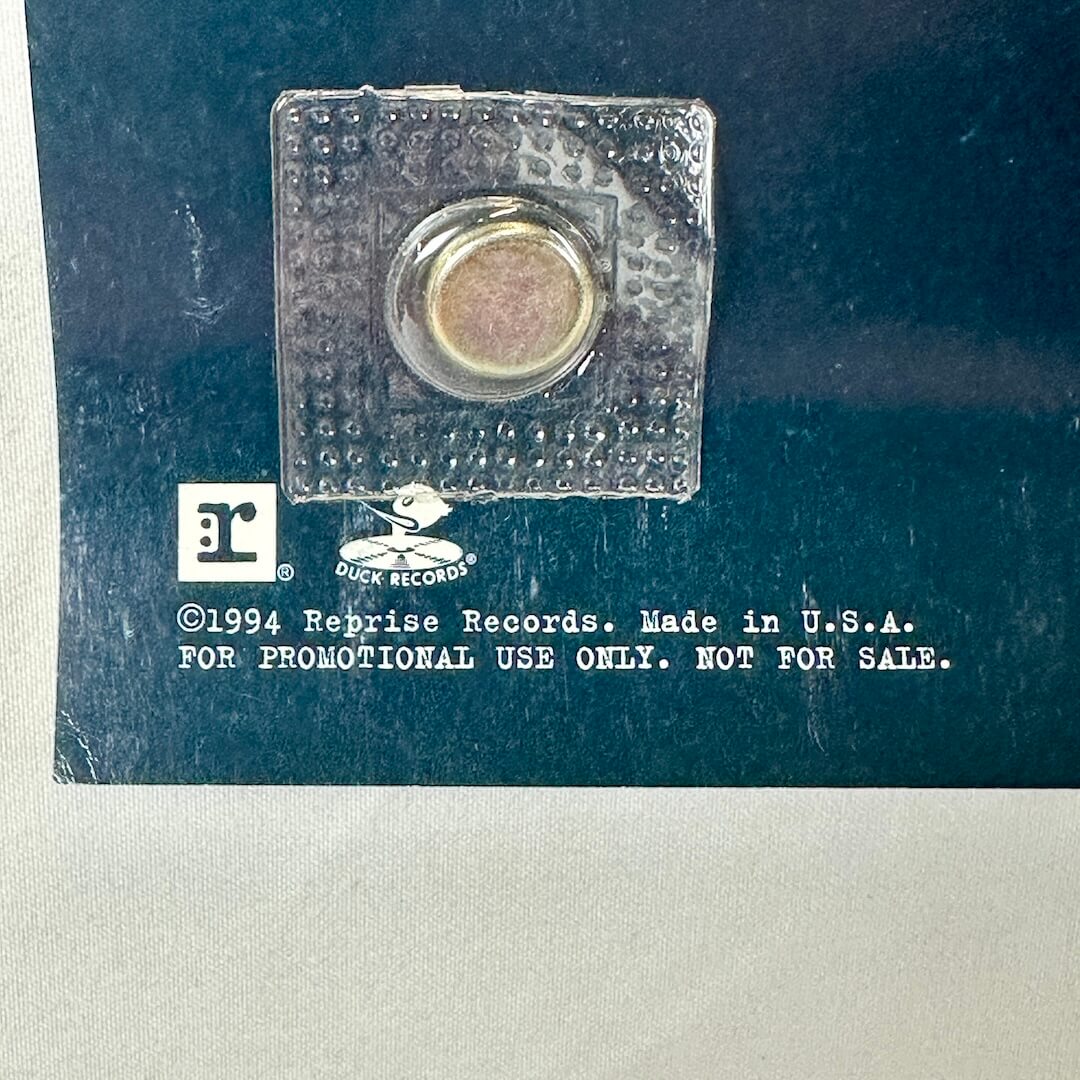 Close-up of promo and copyright information, dating poster to 1994.