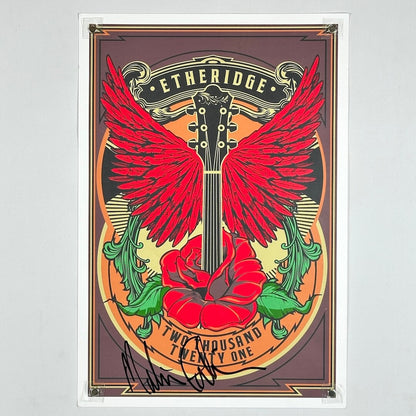 Poster with guitar design, red wings, and rose on a gray background