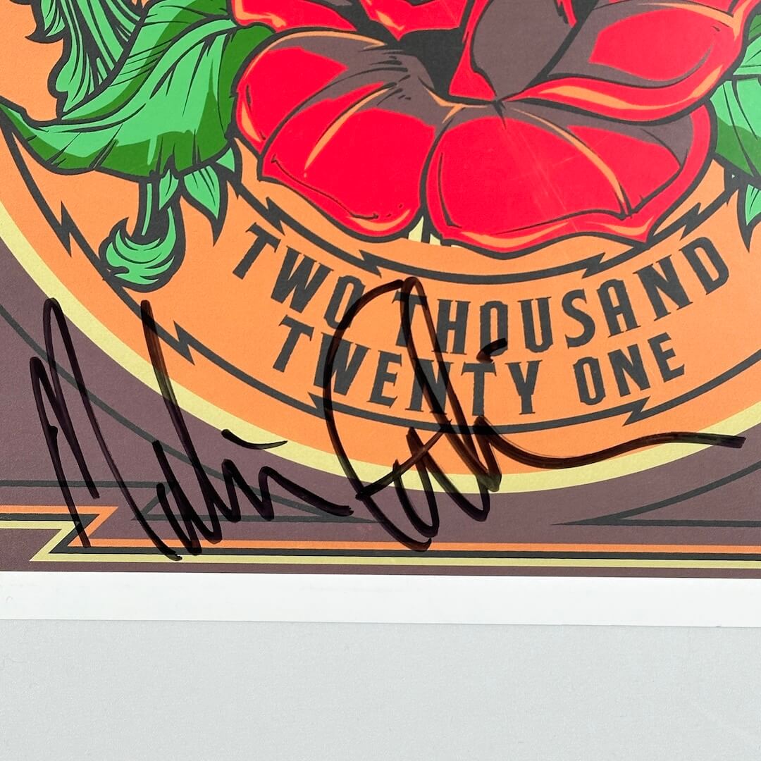 Close up of black marker signature at bottom of poster. 