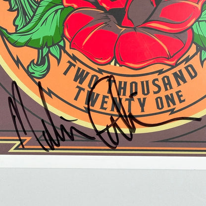 Close up of black marker signature at bottom of poster. 