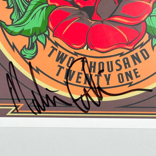 Close up of black marker signature at bottom of poster. 