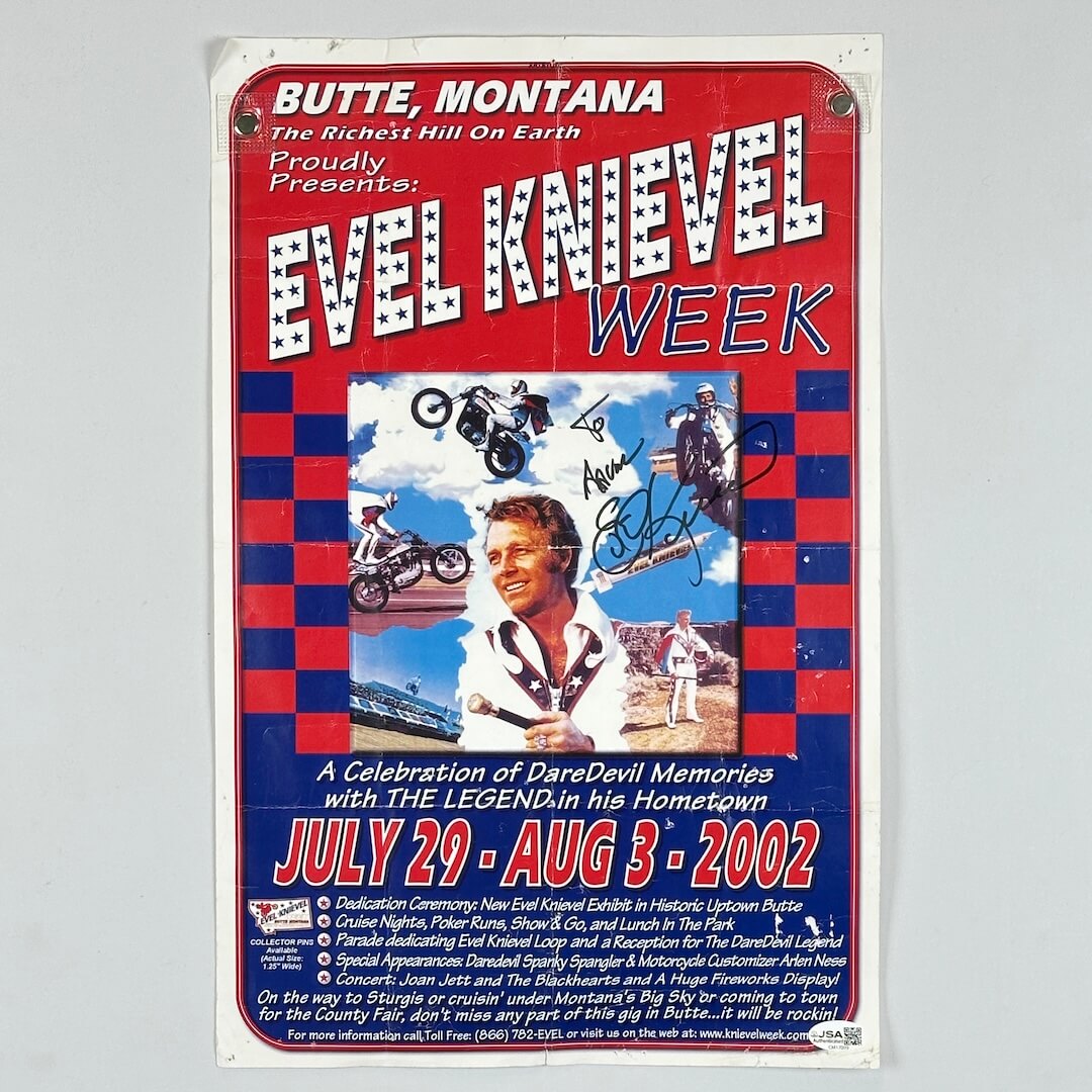 Promotional poster for Evel Knievel Week in Butte, Montana featuring Evel Knievel and checkered design.