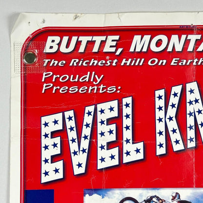 Vintage-style sign with text about Evel Knievel in Butte, Montana