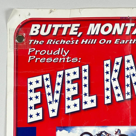 Vintage-style sign with text about Evel Knievel in Butte, Montana