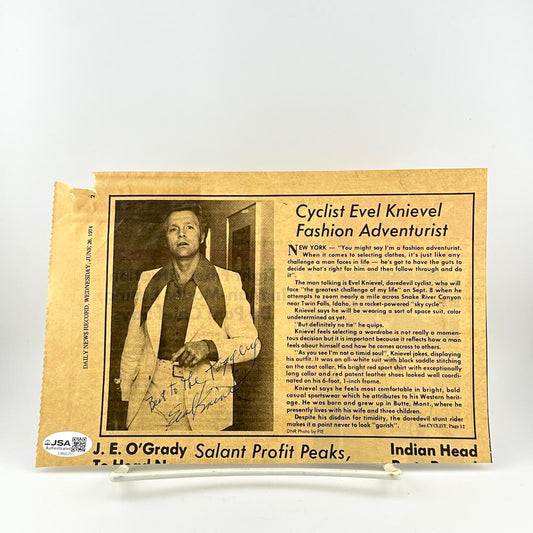 Vintage-style newspaper clipping featuring Cyclist Evel Knievel with text and signature.