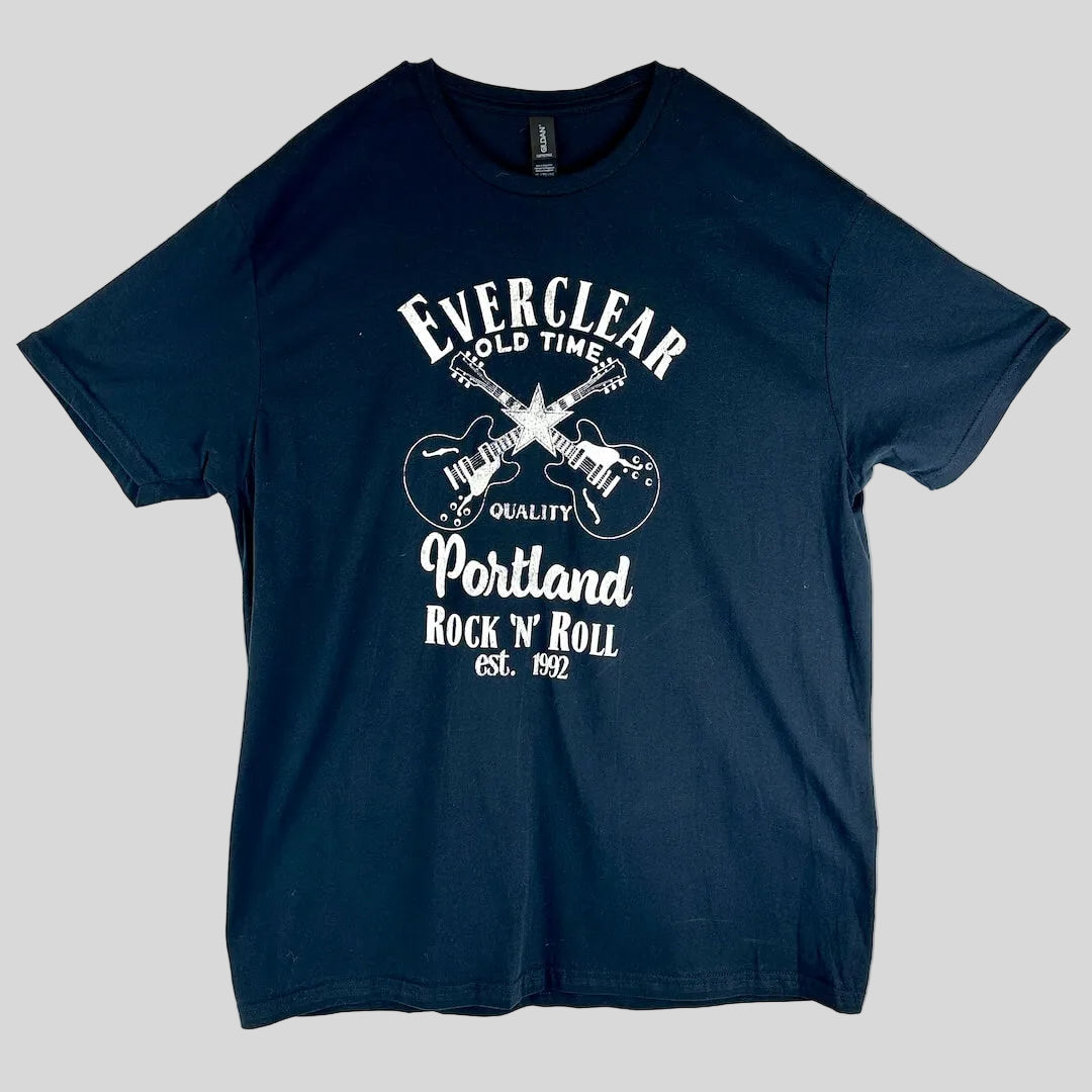 A black short-sleeve t-shirt with a white graphic print on the front featuring crossed electric guitars.