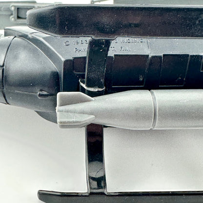 Close-up of a bottom of toy helicopter with repaired section against white background