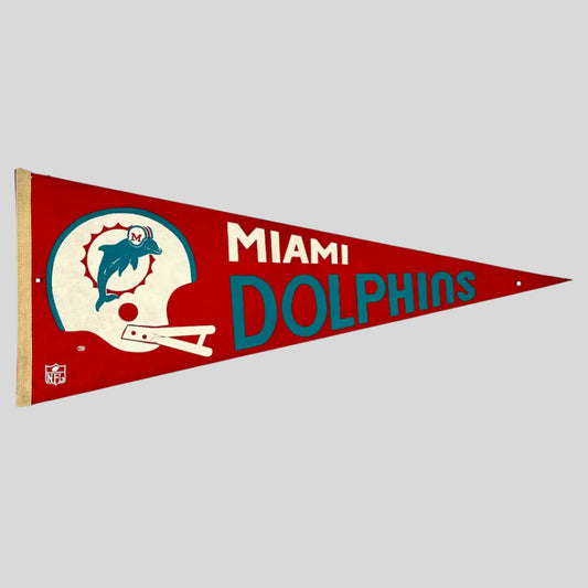 Orange pennant with white helmet with team logo, city name in white text, team name in turquoise print below it. 