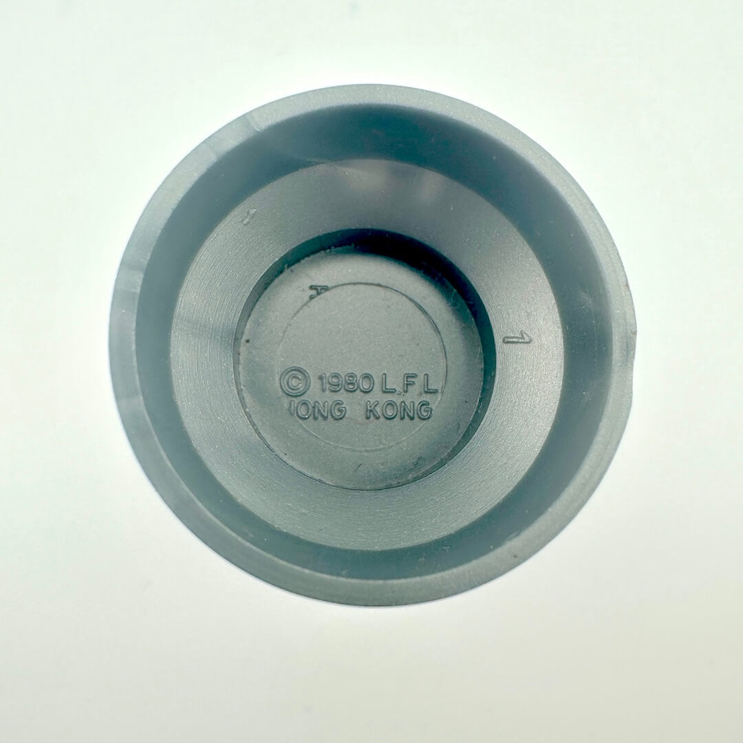 Underside of action figure to show COO and copyright information. 