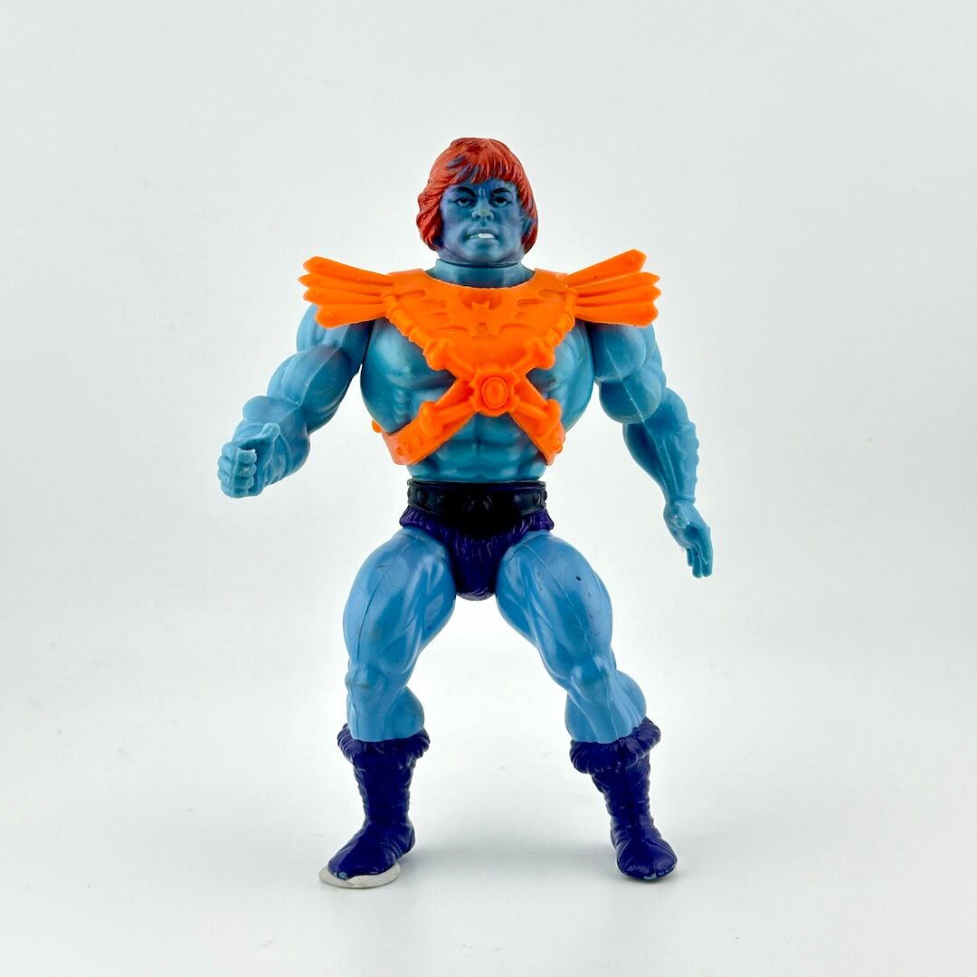 Toy figure with blue skin, orange collar, and purple pants on a white background