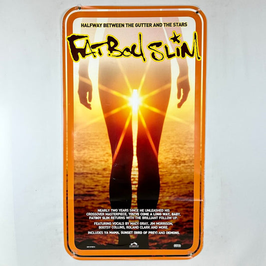 Poster for 'Fatboy Slim: Halfway Between the Gutter and the Stars' with a silhouette against a sunset.
