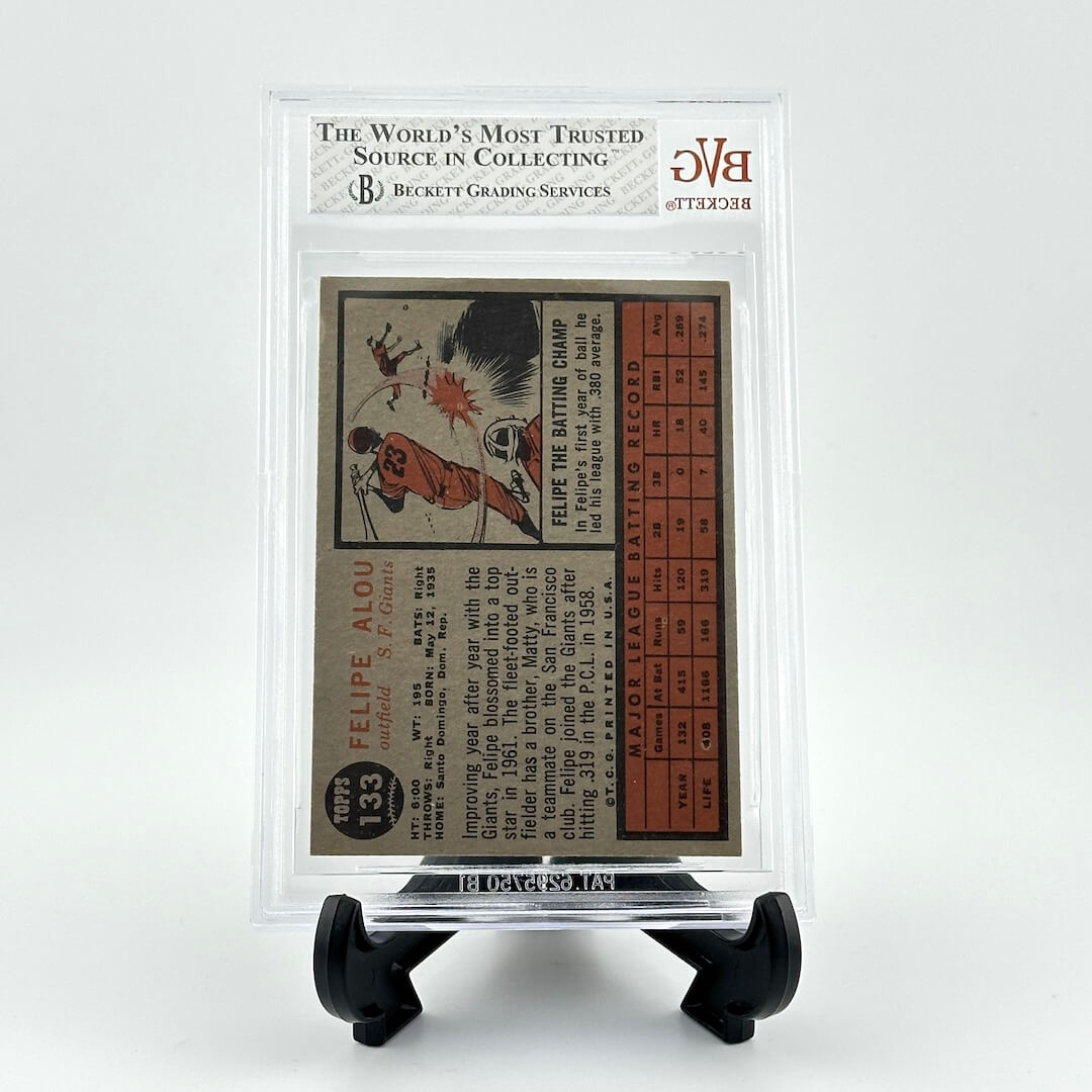 Vintage baseball card in a clear protective case on a white background