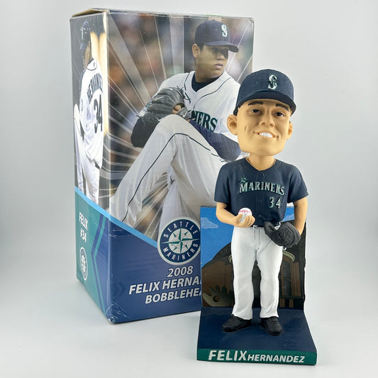 Bobblehead figure of a baseball player with packaging featuring another player, on a white background.