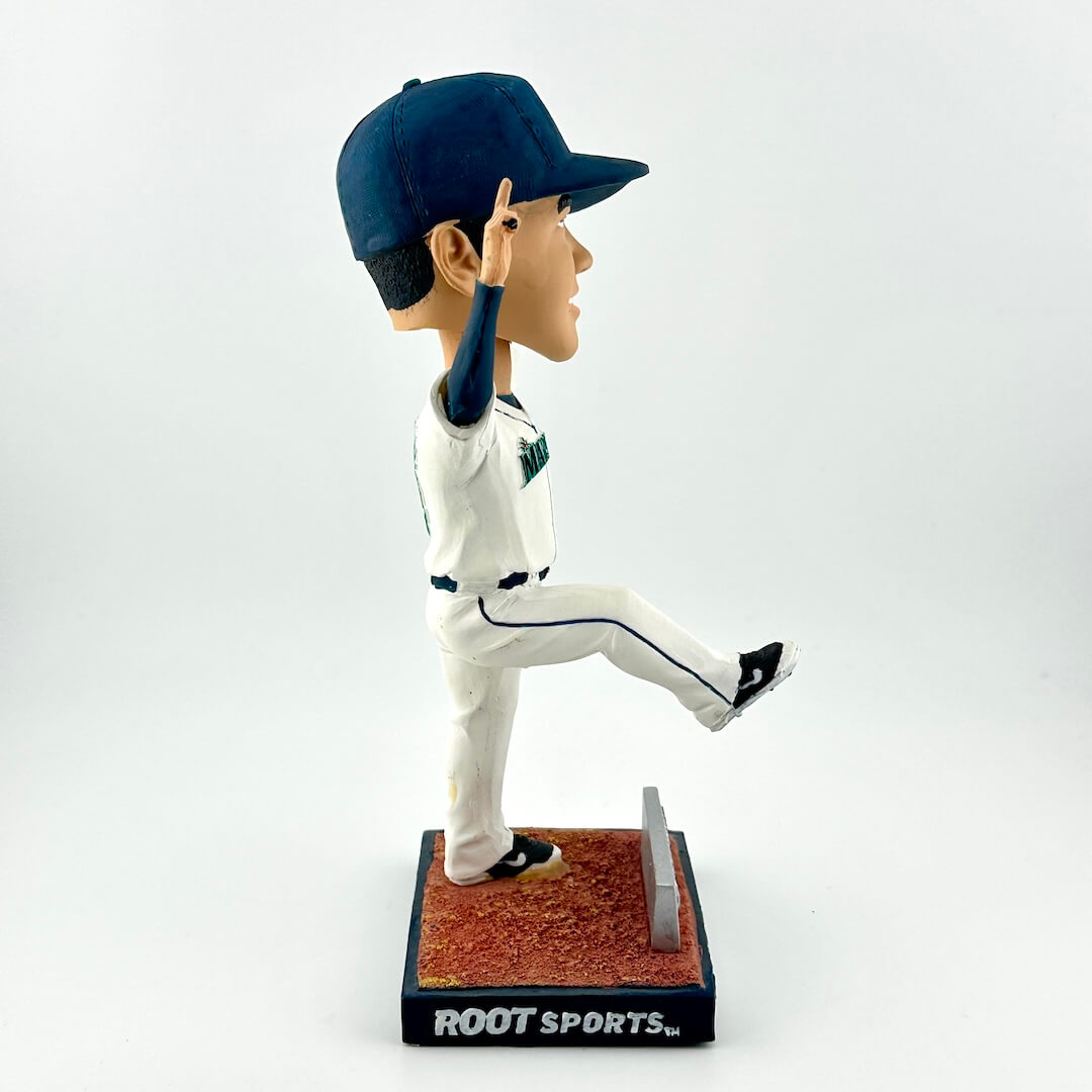 Baseball player bobblehead figure in a pitching pose on a white background