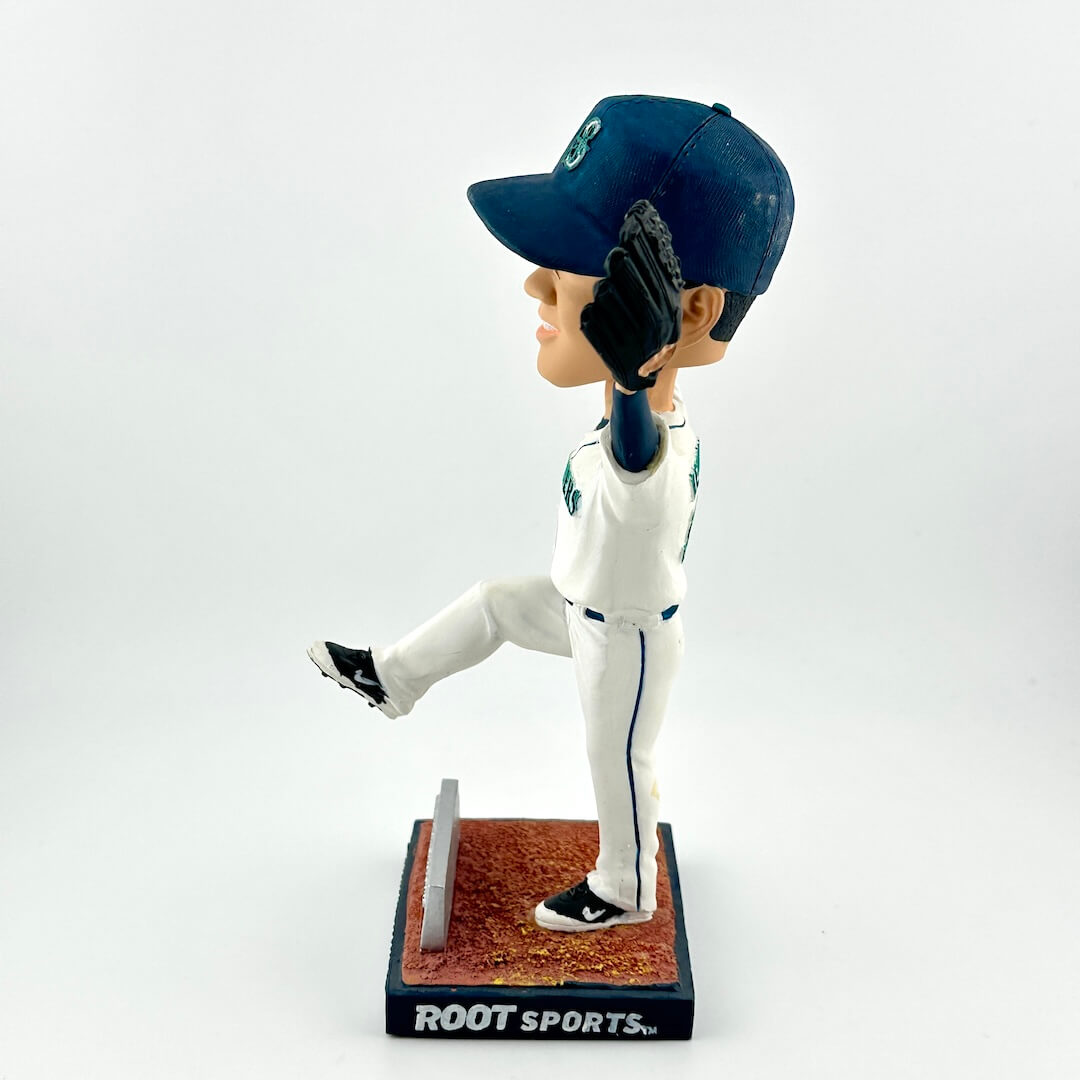Baseball bobblehead figure in a celebrating pose on a white background