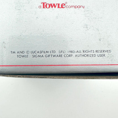 Back of a product with 'Towle Company' branding and legal text.