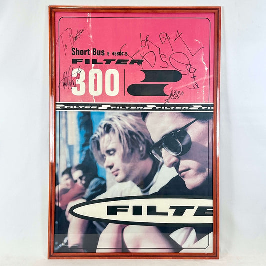 Framed poster with a red top section and a portrait of two people at the bottom, featuring the word 'FILTER'.
