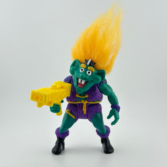 Teal skinned troll with yellow hair that sticks straight up wearing purple vest & shorts, shiny black boots with purple trim. 