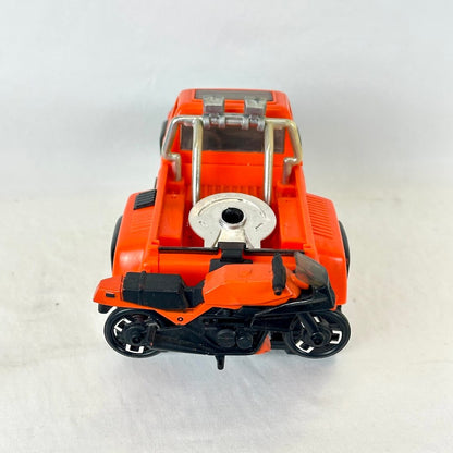 An orange toy pickup truck with a small black and orange motorcycle attached to the back.