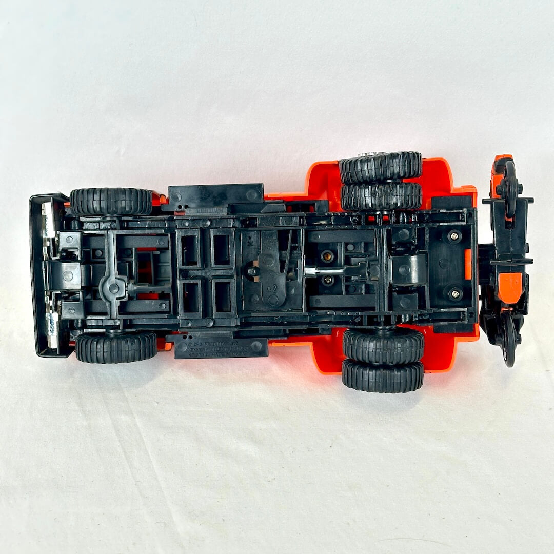 Underside of toy showing minimal wear to wears and gears. 