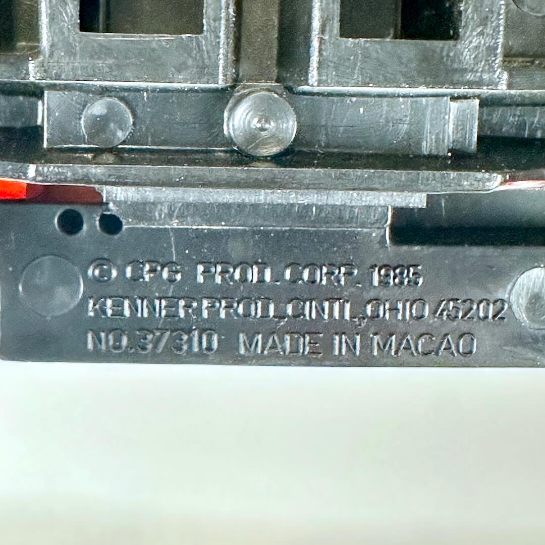 Close-up of copyright and maker information embossed on underside. 