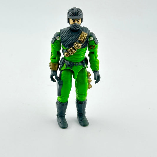 Toy figure in green and black outfit on a white background