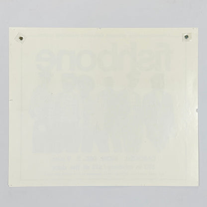 Backside of white poster against white background. 