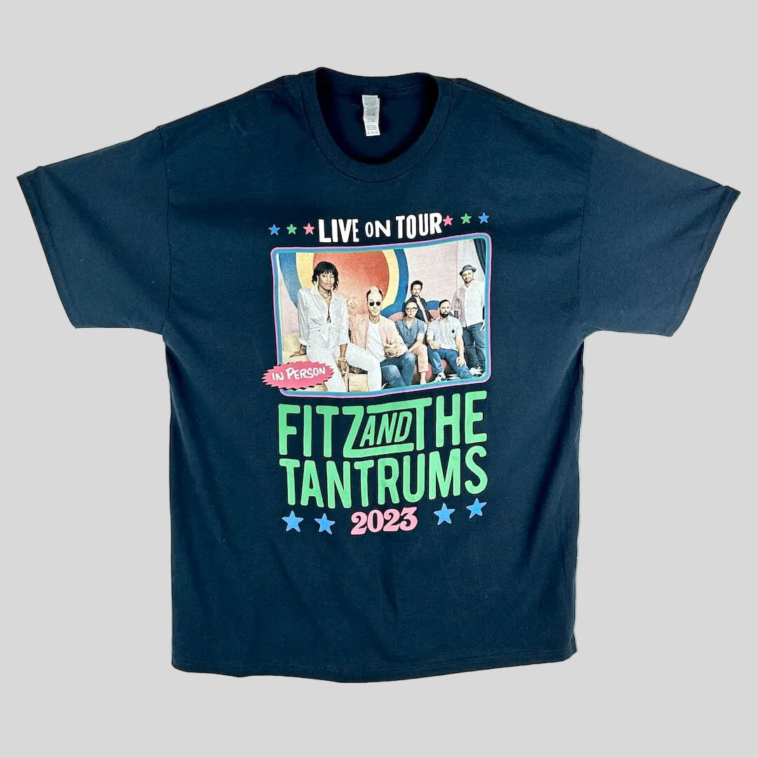 A black short-sleeve graphic t-shirt laid flat, featuring a large front print for the band Fit and the Tantrums 2023.