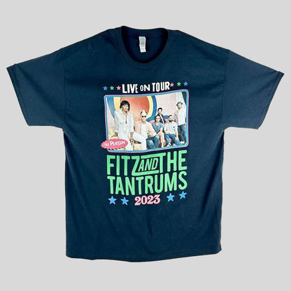 A black short-sleeve graphic t-shirt laid flat, featuring a large front print for the band Fit and the Tantrums 2023.