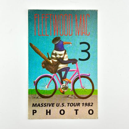 Photo pass featuring image of bird wearing clothes on bicycle under 'Fleetwood Mac' with other details along bottom. 