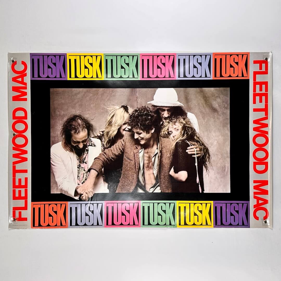 Fleetwood Mac poster of album cover for 'Tusk' with band members and colorful text on a white background