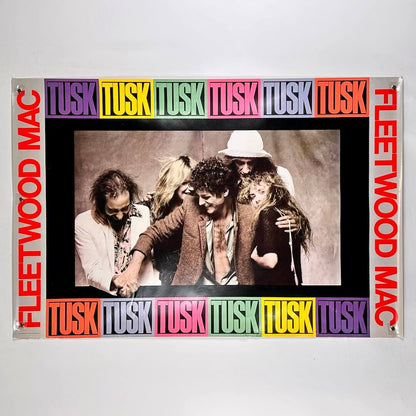 Fleetwood Mac poster of album cover for 'Tusk' with band members and colorful text on a white background