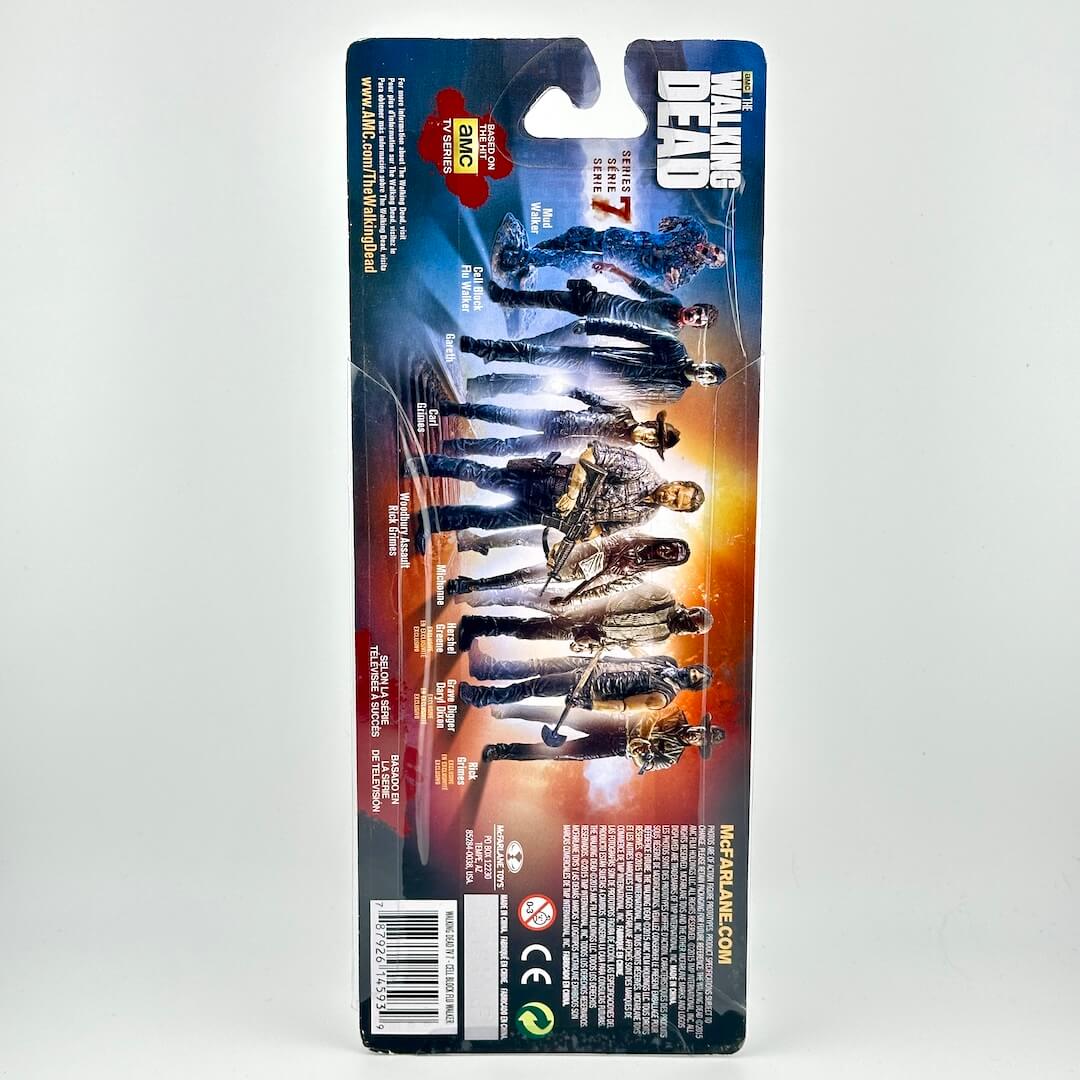 Packaged action figure from The Walking Dead, shown from the back of its retail blister card packaging.