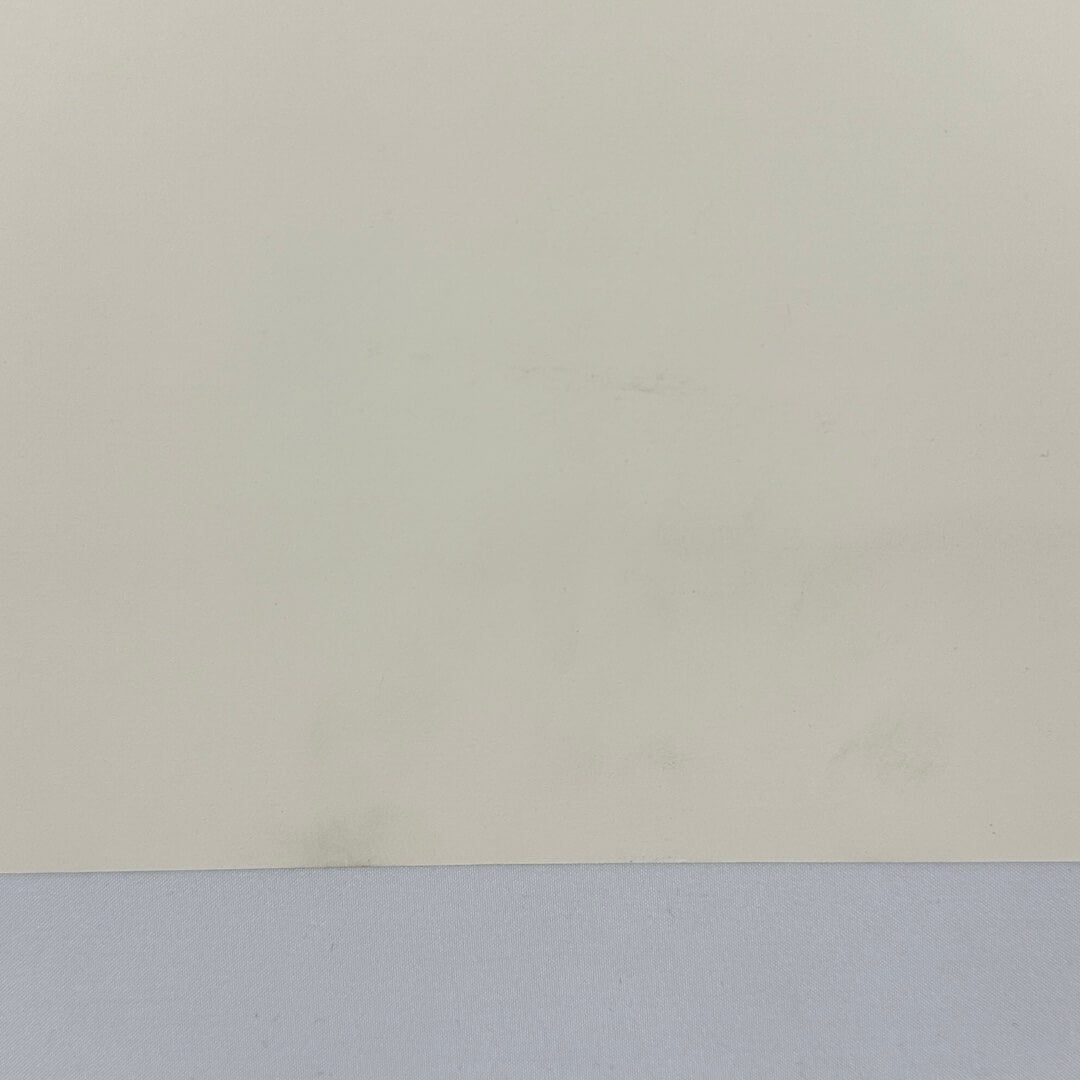 Smudge at bottom center of backside of poster. 