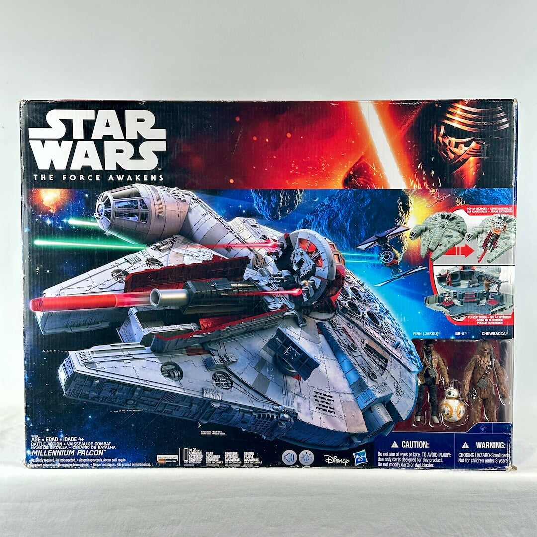 Star Wars Force Awakens Millennium Falcon in packaging with image of Falcon in battle scene on box. 