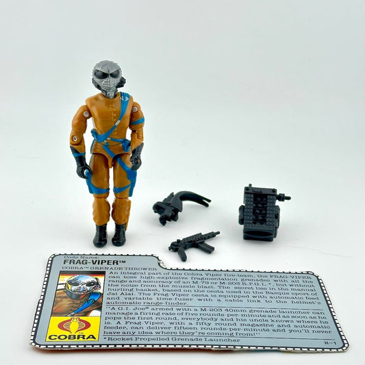 Toy figure of a character in orange and blue suit with accessories on a white background