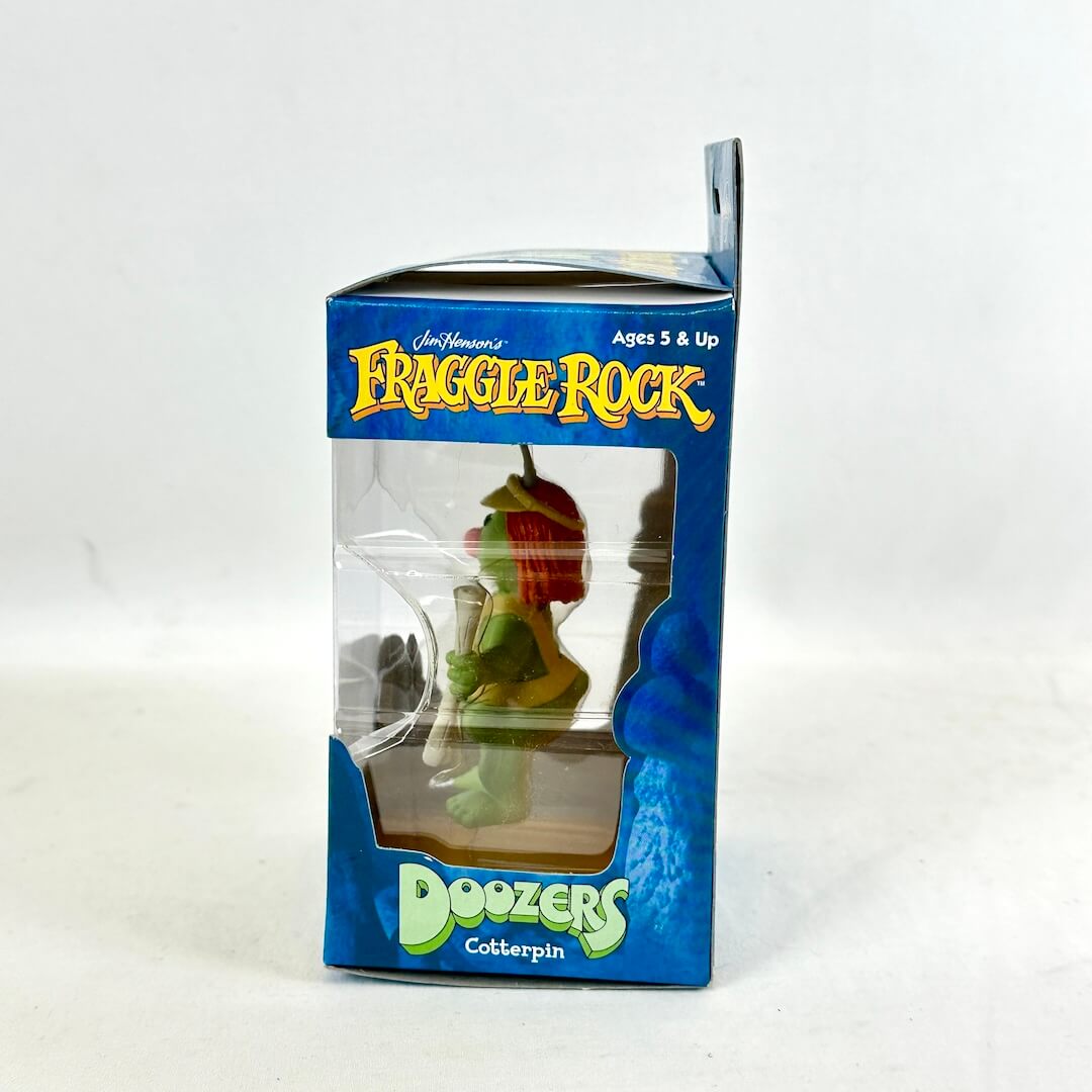 Fraggle Rock Doozers Cottterpin toy figure in packaging on a white background