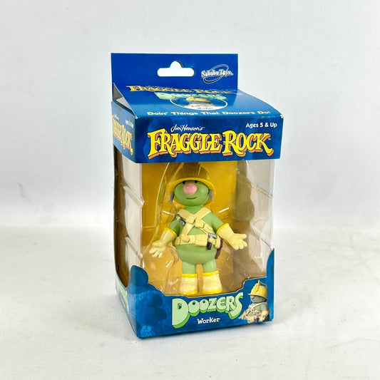 Small toy figure in blue and green box with "Fraggle Rock" branding against white background. 