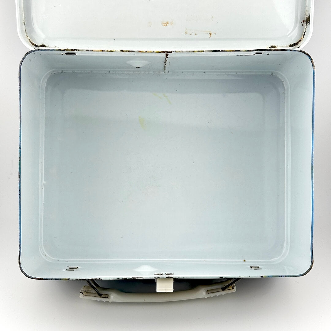 Metal lunchbox with white interior with sporadic spots of rust and wear to edges. 