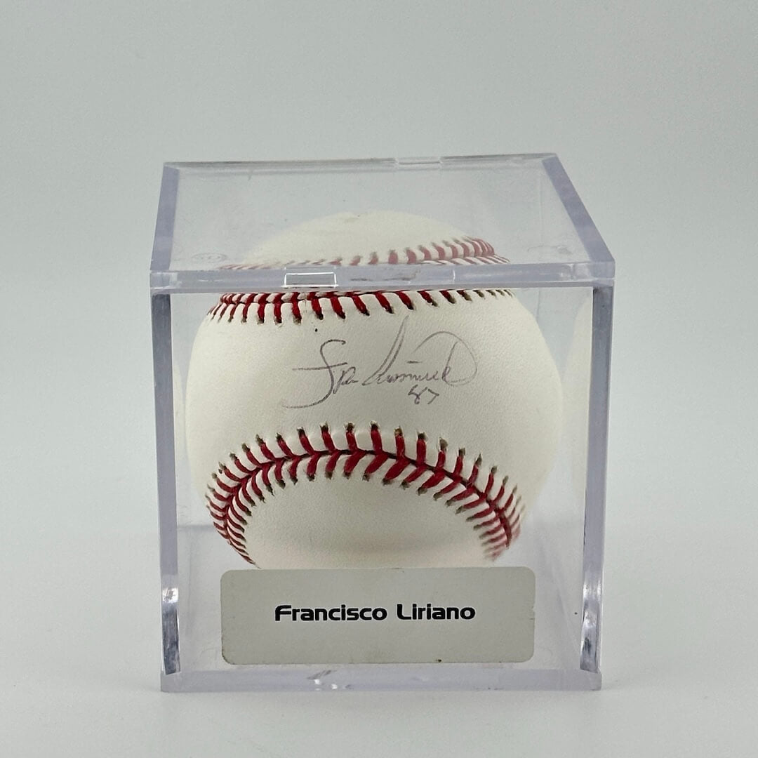 Autographed baseball in plastic cube with sticker label along bottom.