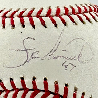 Close up of black pen signature in narrow section between red stitching, the "sweet spot. "