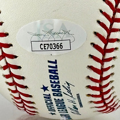 Close up of JSA authentication sticker next to MLB ball information stamp.