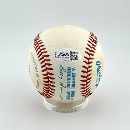 Baseball with JSA authentication sticker on a white background
