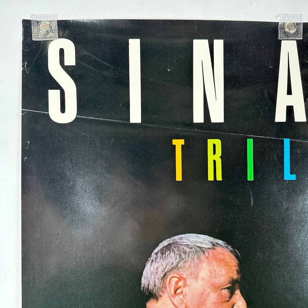 Top left corner of poster with scratches and crease.