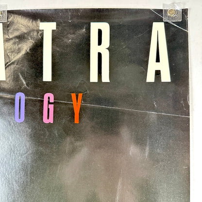 Top right corner of poster with creases and scratches.