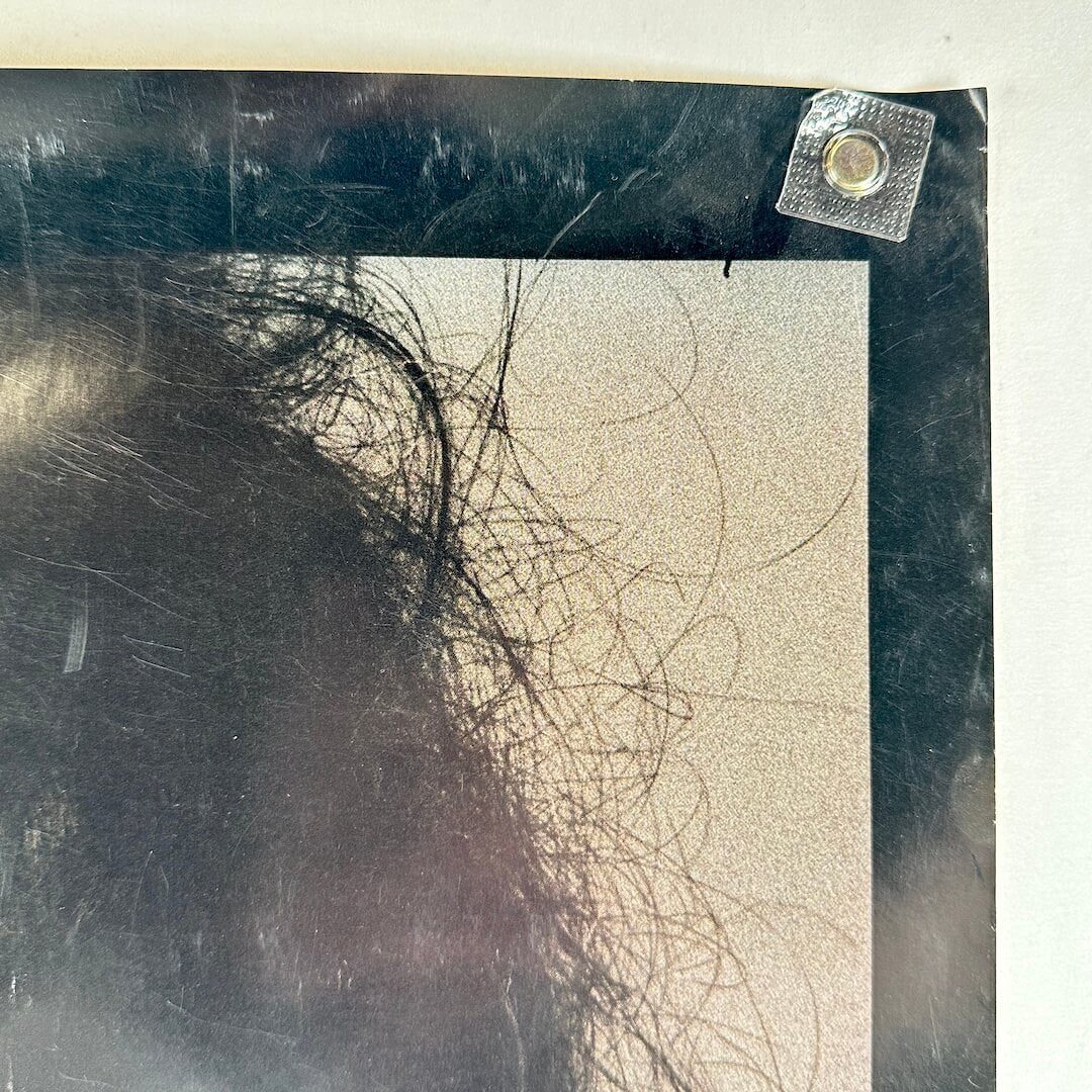 Upper right corner with scratches and wear to edges