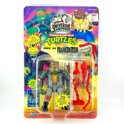 Toy figure of Mike as Frankenstein from Teenage Mutant Ninja Turtles in colorful packaging.