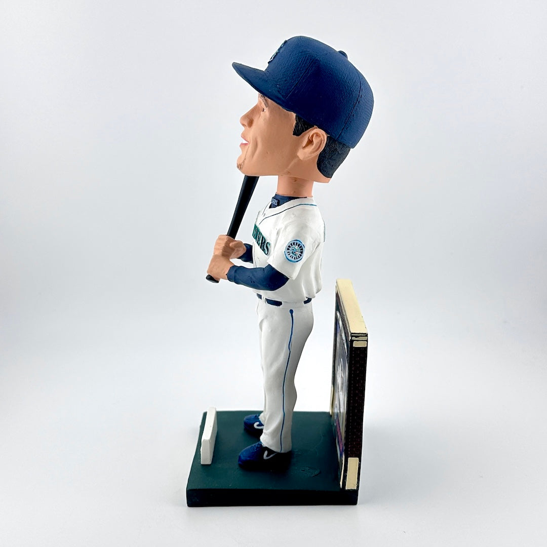 Baseball bobblehead figure holding a bat on a white background